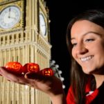 model maker holds tiny lego pumpkins by lego big ben miniland