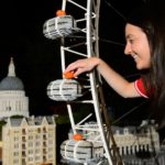 model maker puts tiny lego pumpkin on lego london eye with lego st pauls in background
