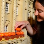 model maker puts tiny lego pumpkins on lego buckingham palace