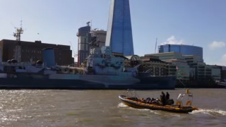Thames RIB Experience goes past the HMS Belfast and the Shard