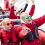 two happy kids on the thames rocket boat tour