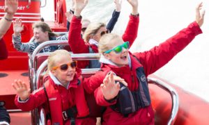 two happy kids on the thames rocket boat tour