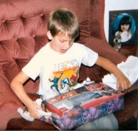 Tony Way as a kid opening a Christmas present