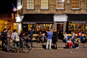 People cycling through the streets of Broadway Market, Hackney