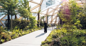 Woman standing at Crossrail Place Roof Garden