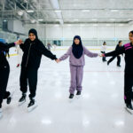 group of girls skating on ice