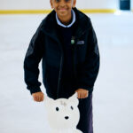 Child pushing a skate aid at lee valley ice centre