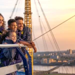 a family looking over London from the top of the O2