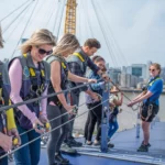 a group of people climbing up the O2