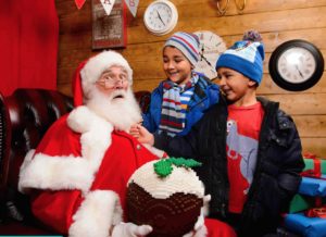legoland christmas bricktacular santa with two boys and a lego figgy pudding