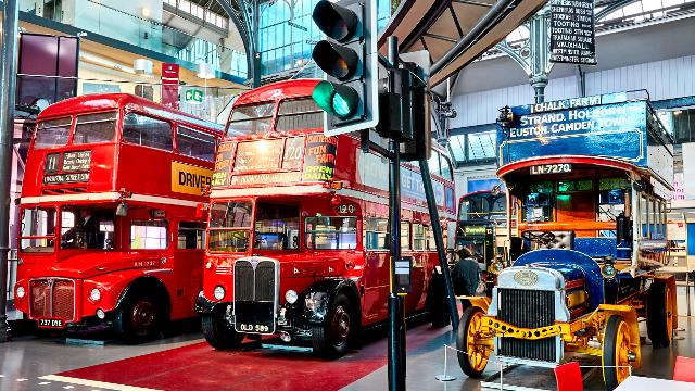 Buses and old fashioned cars at the London transport musuem.