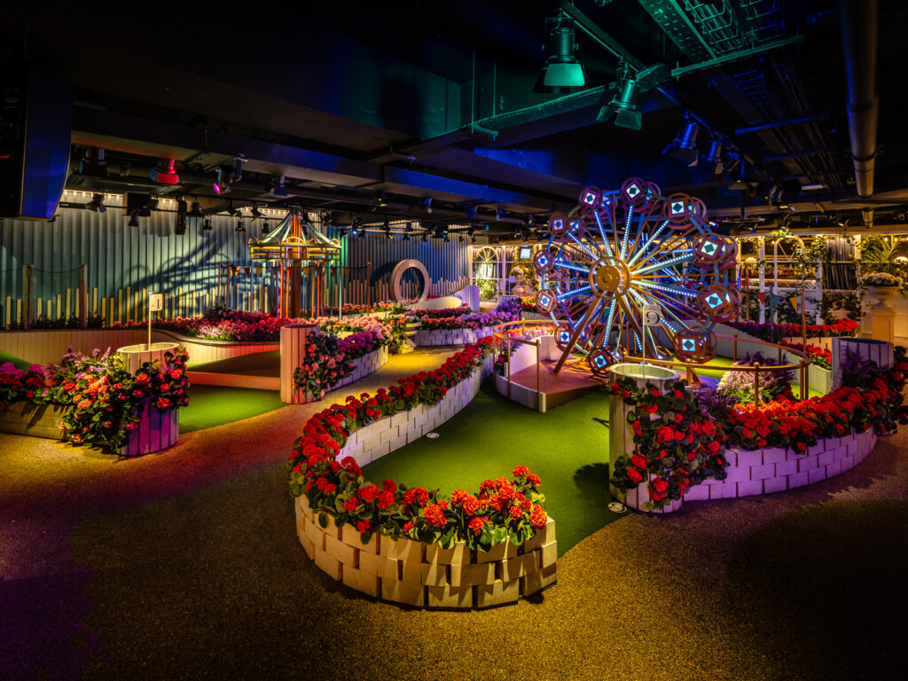 Crazy golf course with lights, miniature big wheel