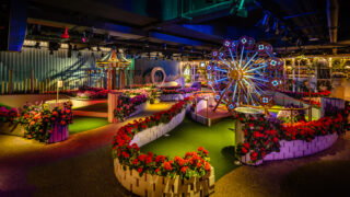 Crazy golf course with lights, miniature big wheel
