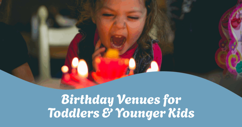 young kid blowing out birthday candles at a party