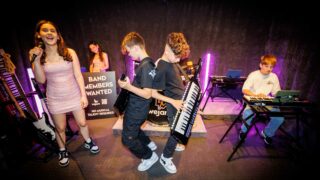 2 boys playing keytars at WeJam