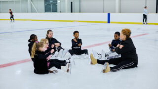 Kids sat on ice at Lee Valley Ice Centre