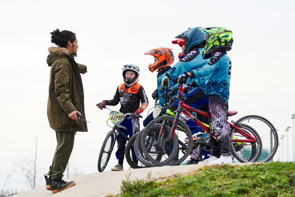 group of kids on the BMX pump track at Lee Valley Velopark