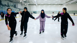 group of girls skating on ice