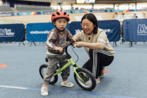 preschooler learning to ride a balance bike
