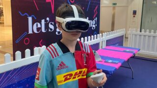 boy wearing VR headset holding controllers at VRXtra Kingston