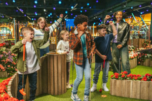 mixed group of kids playing indoor crazy golf at Swingers for KidRated